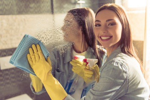 Cleaner using protective equipment during carpet cleaning